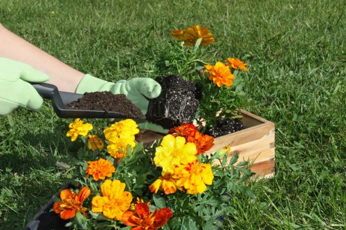 Documentation and insurance certificates on a clipboard at a gardening site